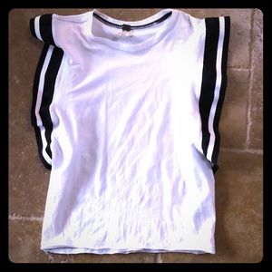 Free People White top with large ruffle sleeves.